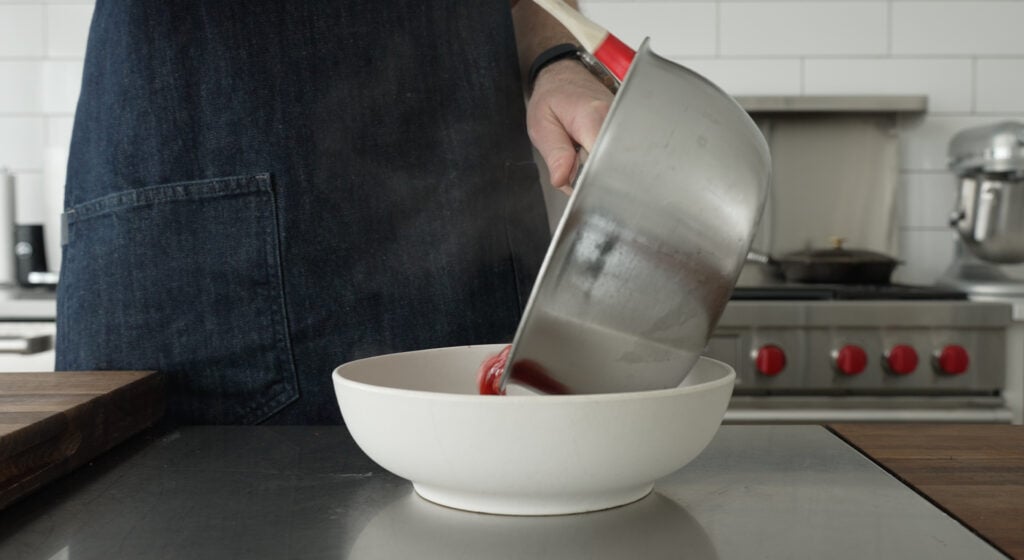 pouring the sauce into a bowl