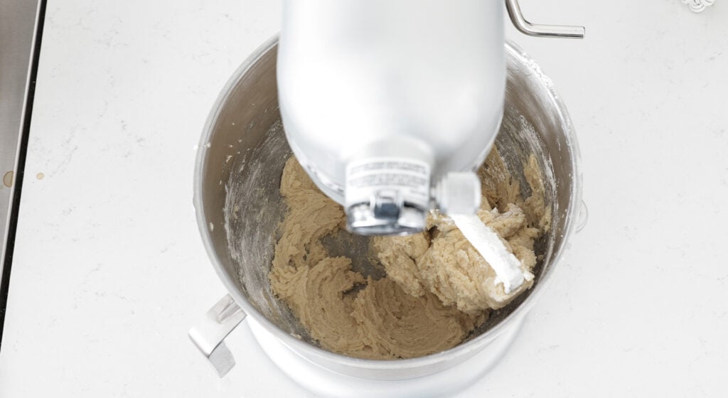 Beating the ingredients together with a stand mixer