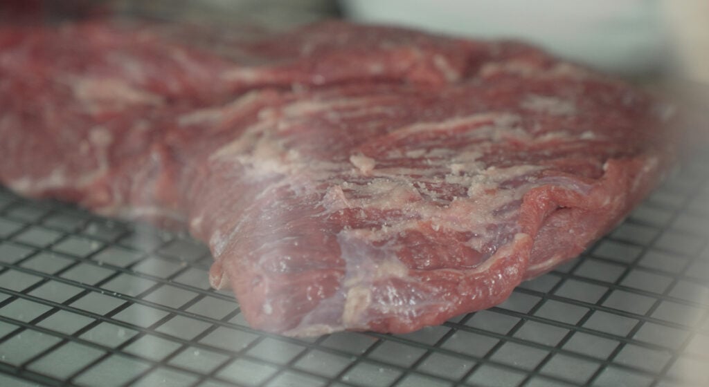 salted steak on a wire rack