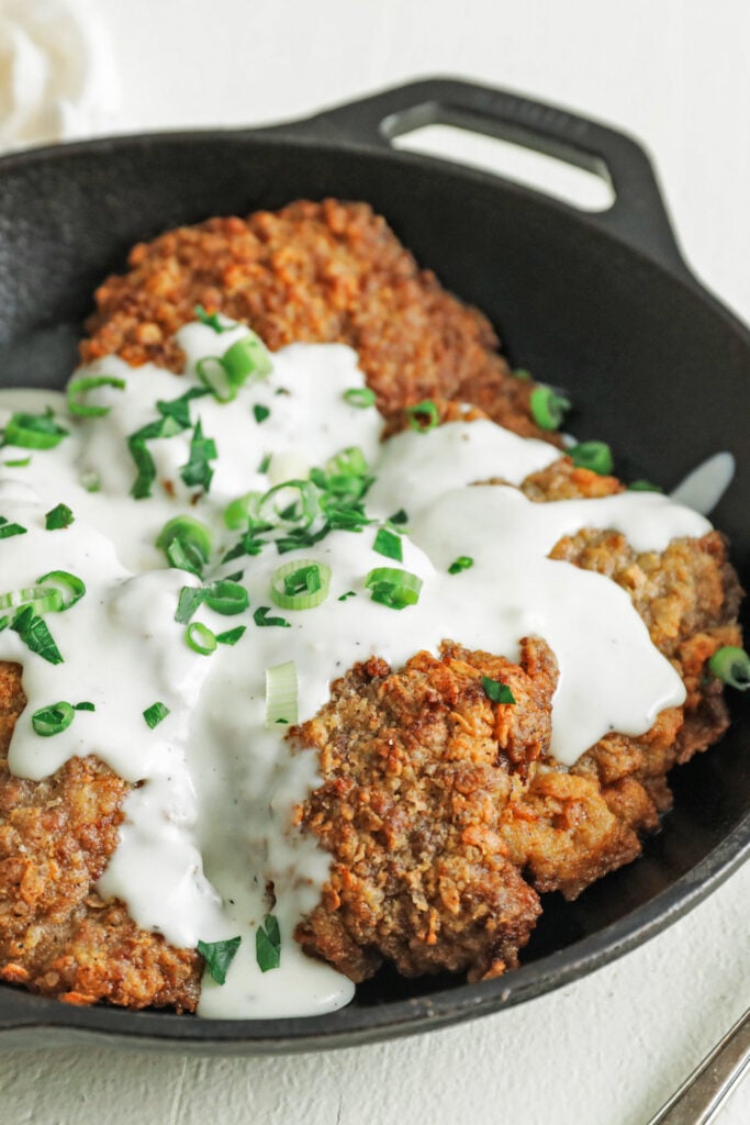 fried steak with breading and gravy