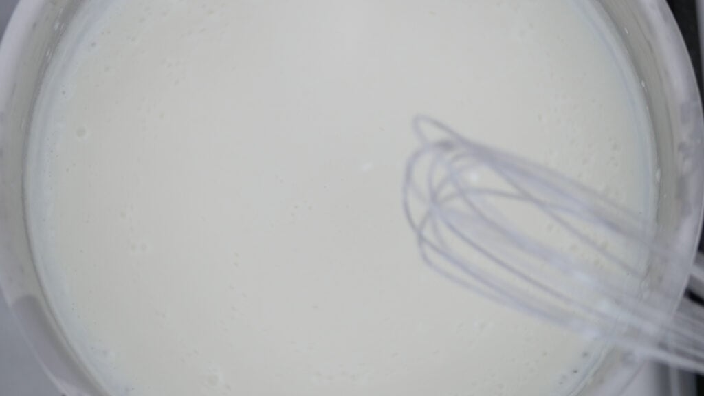 whisking a gravy in a pot