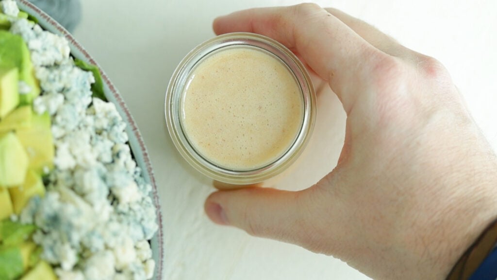 serving dressing with a salad