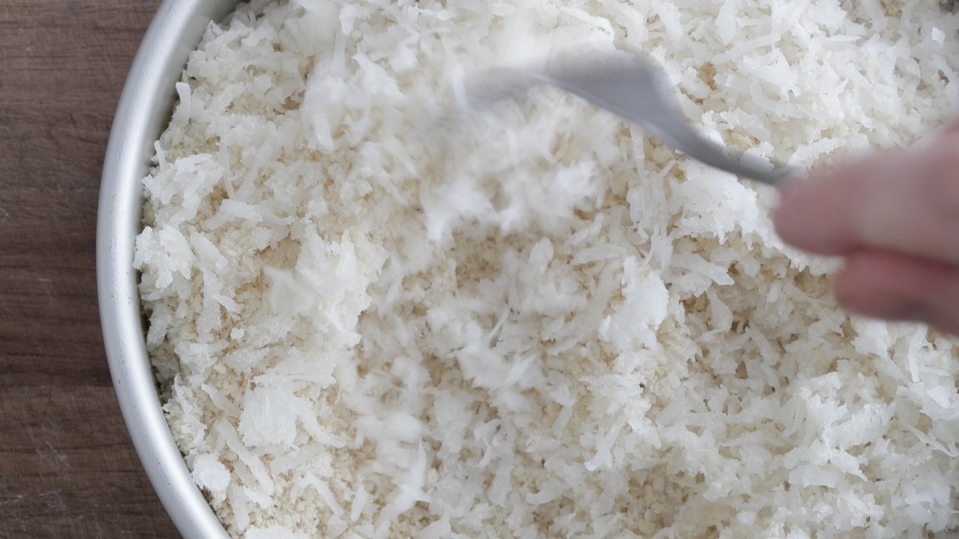 whisking coconut shreds and panko