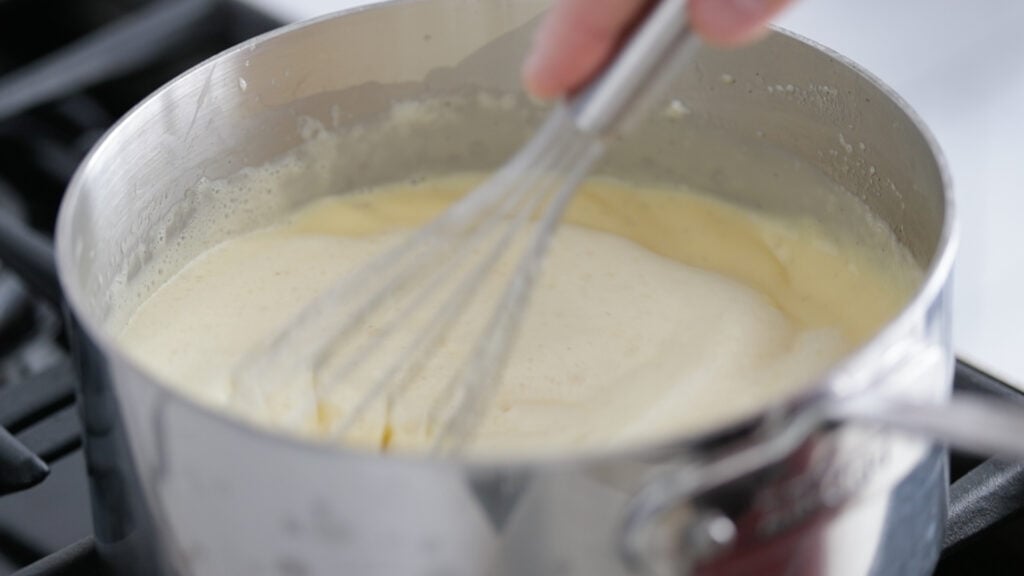 cooking the sauce in a pan