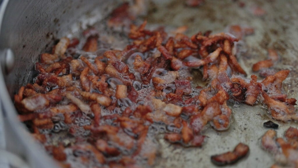 cooking thick cut bacon in a pan