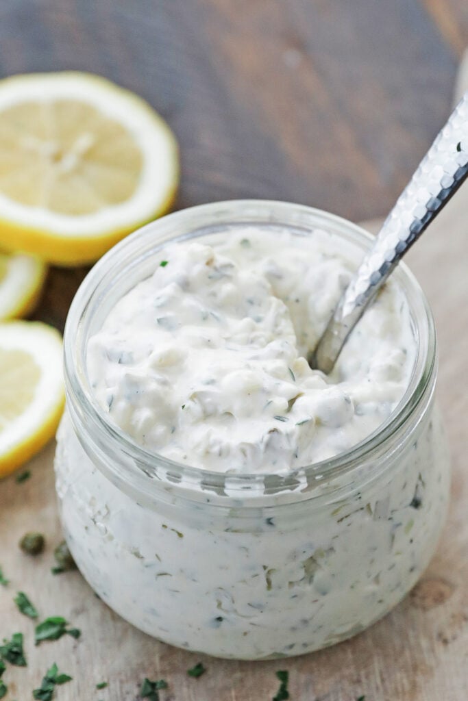jar of homemade tartar sauce with a spoon