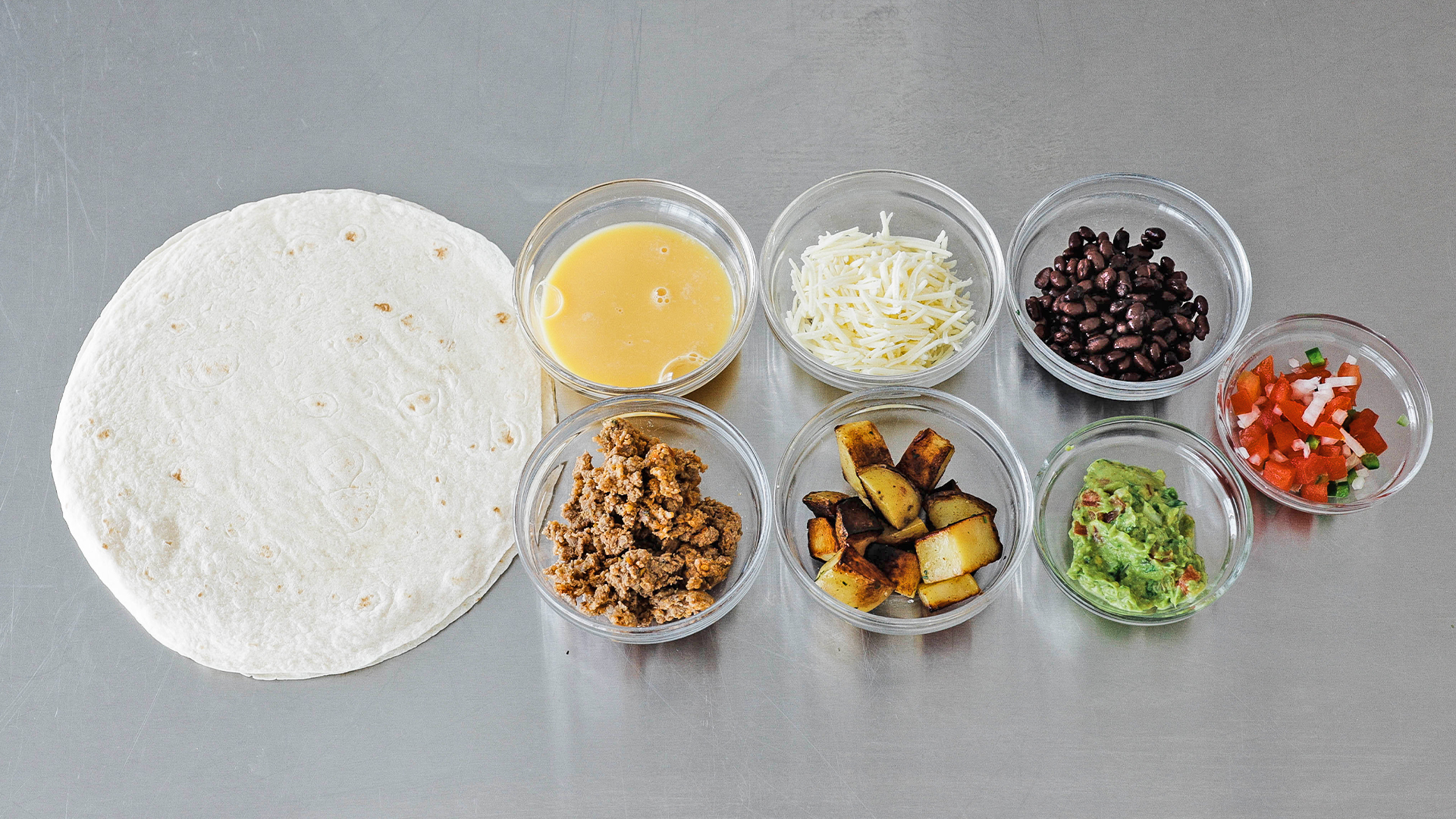 ingredients to make a breakfast burrito