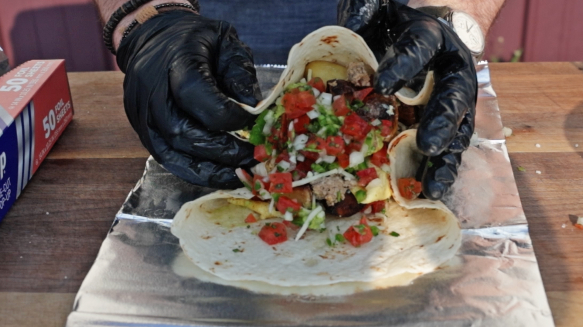 rolling up a breakfast burrito