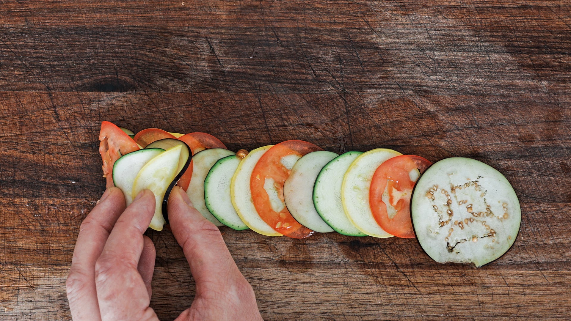 rolling up sliced veggies