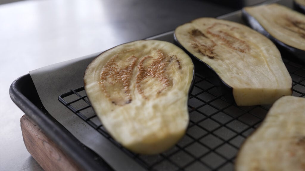 air dried sliced eggplants on a rack