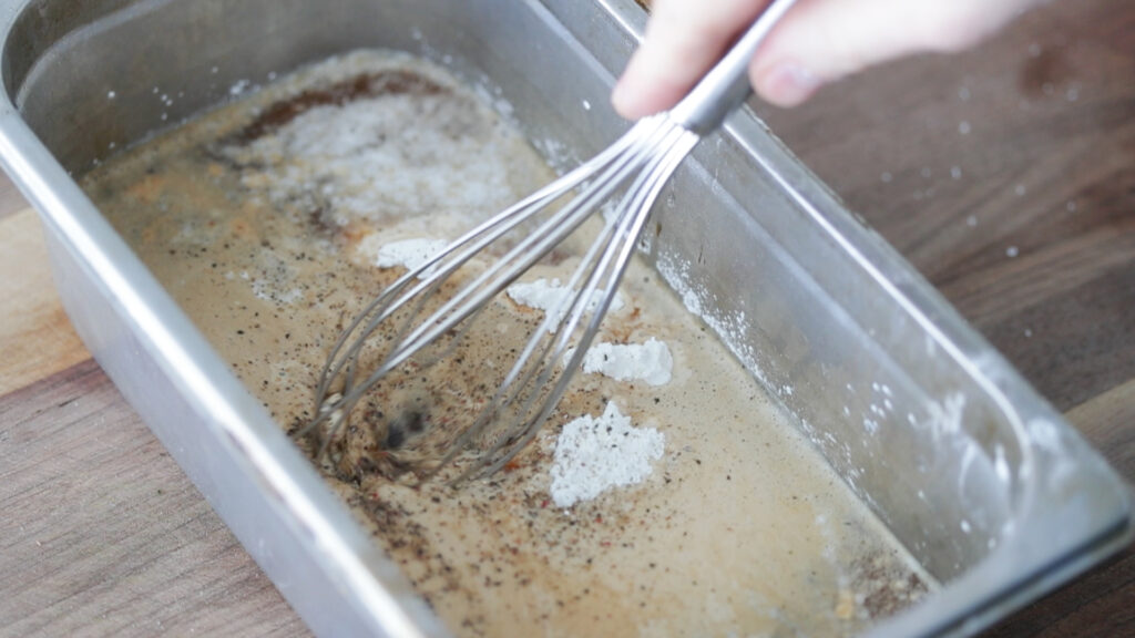 adding beer to a fish fry batter