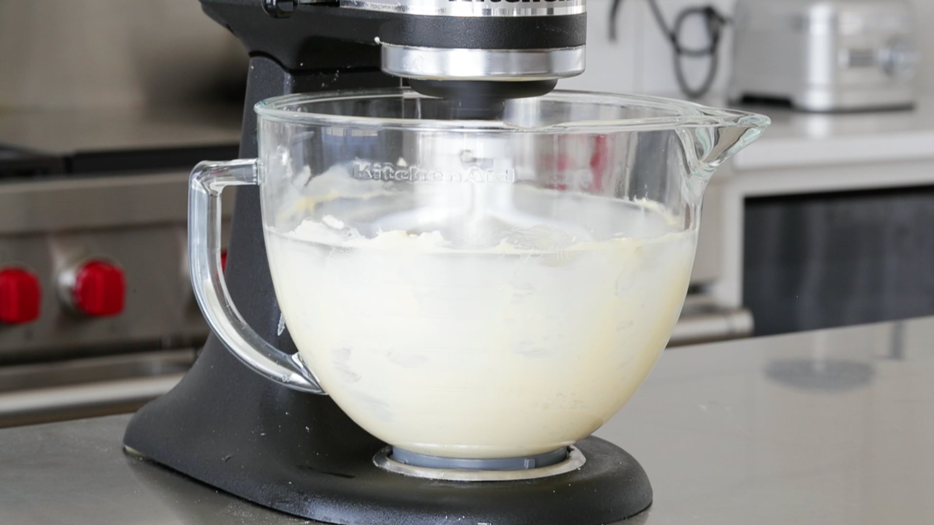 pouring sugar to a mixer