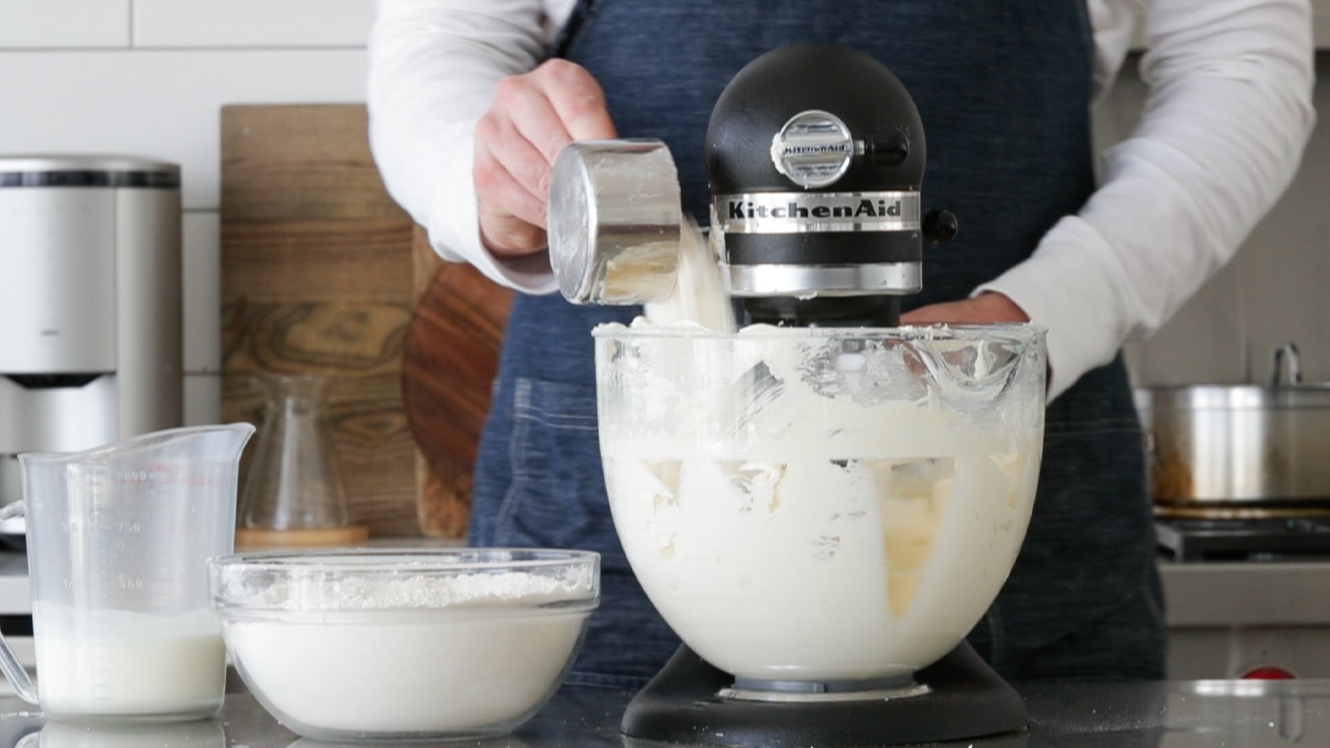 adding buttermilk to a mixer