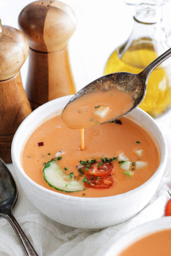 spoonful of gazpacho in a bowl