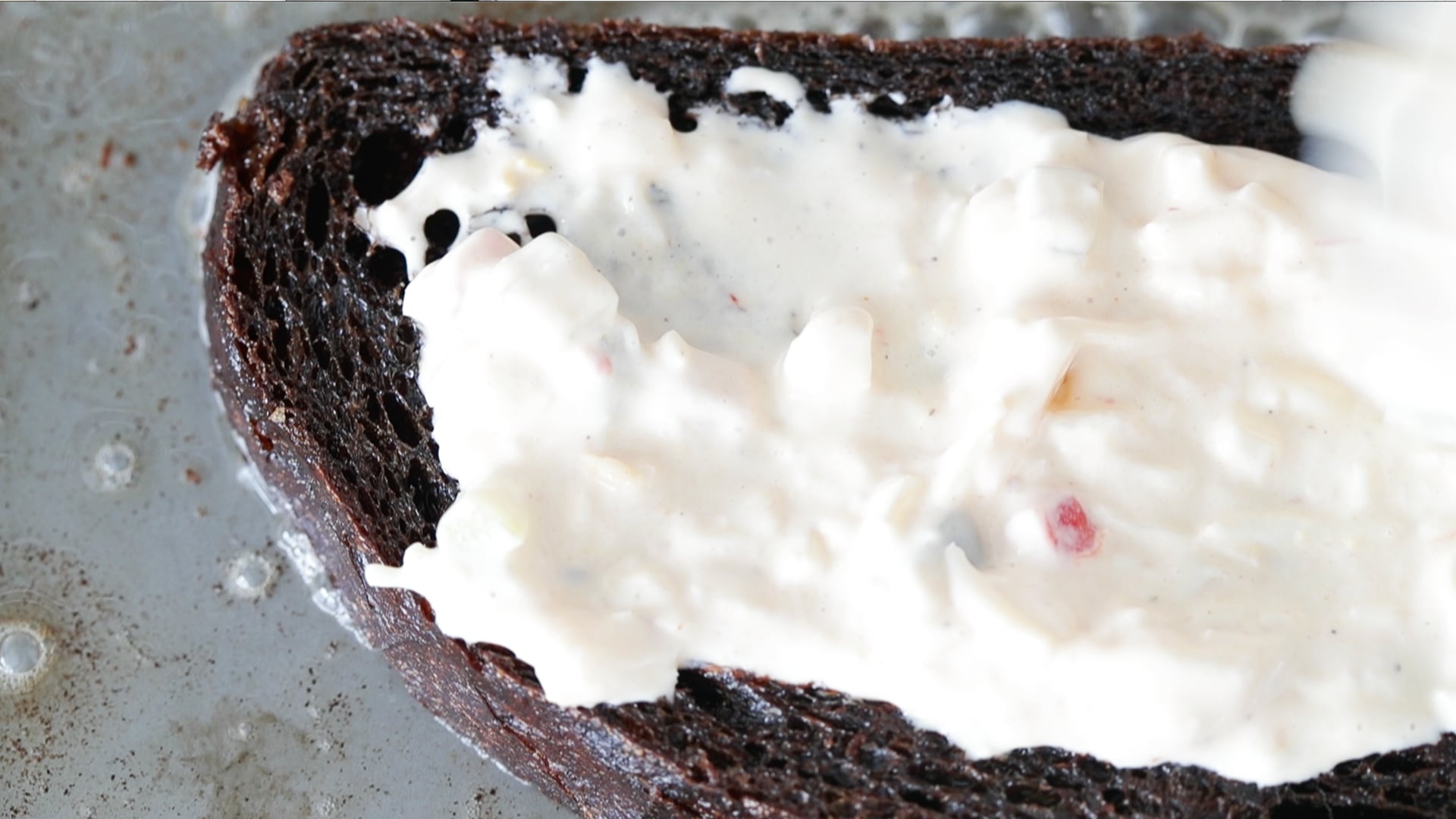 spreading thousand island onto bread