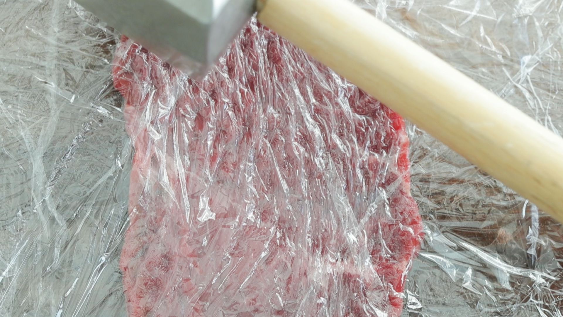 pounding top sirloin steak