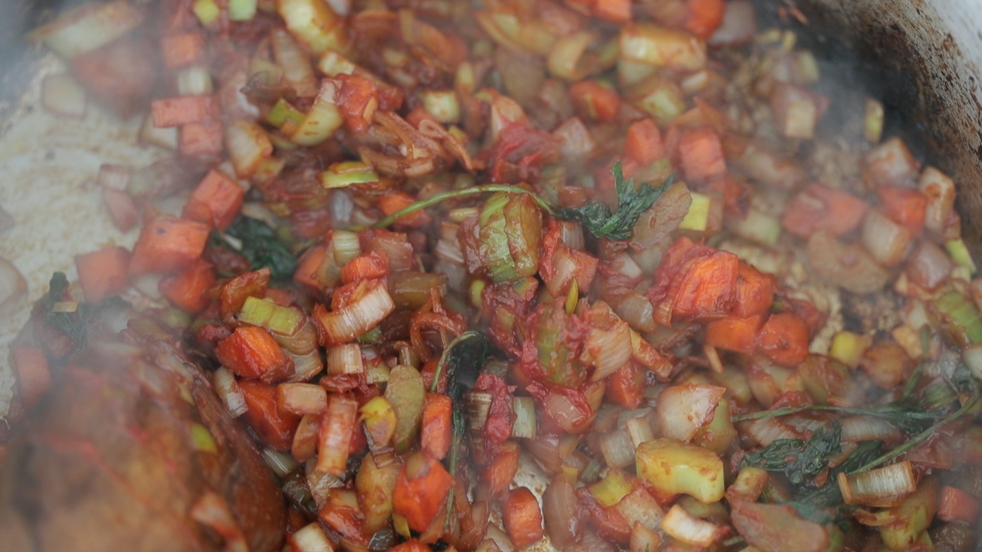 cooking mirepoix in a pan