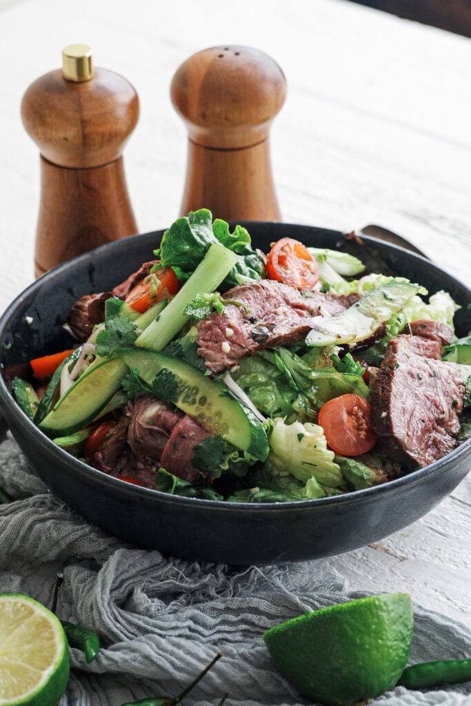 Thai Beef Salad in a black serving bowl