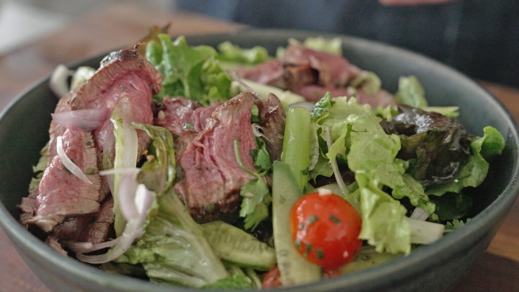 Close up of finished salad with dressing added