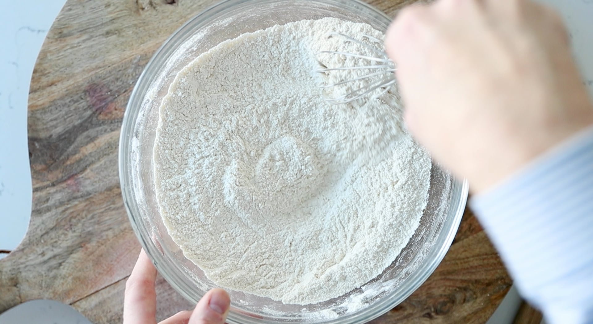 whisking flour in a bowl