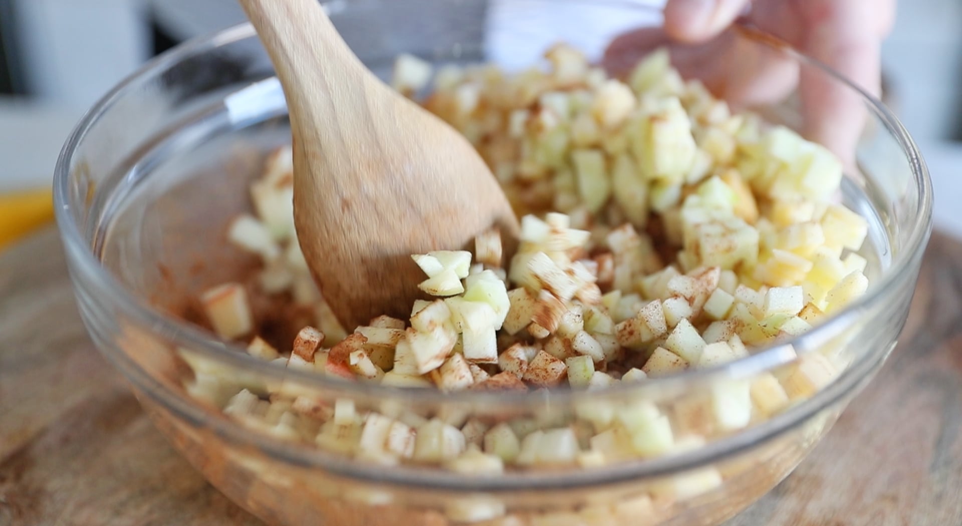 mixing apples and spices together