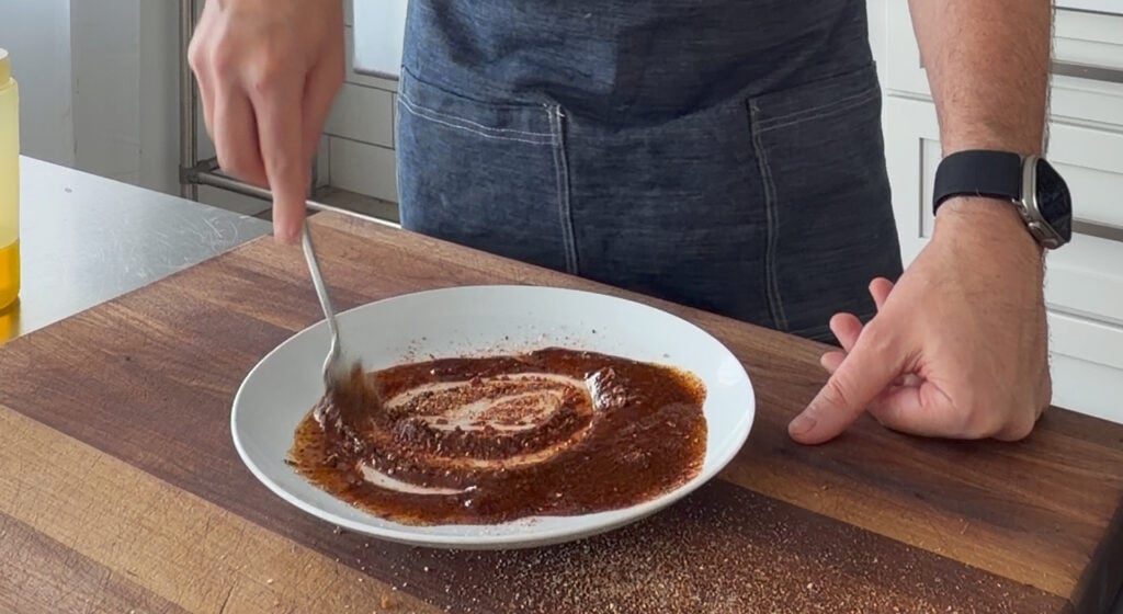 mixing seasonings with oil