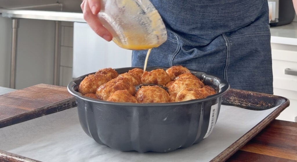pouring the melted butter mix over the top