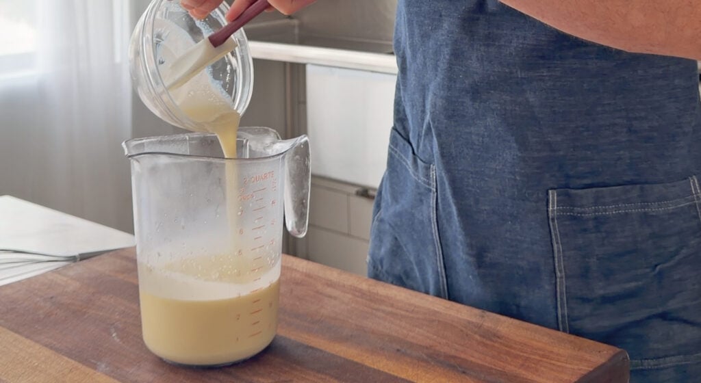pouring the dissolved gelatin into the sweetened vanilla cream