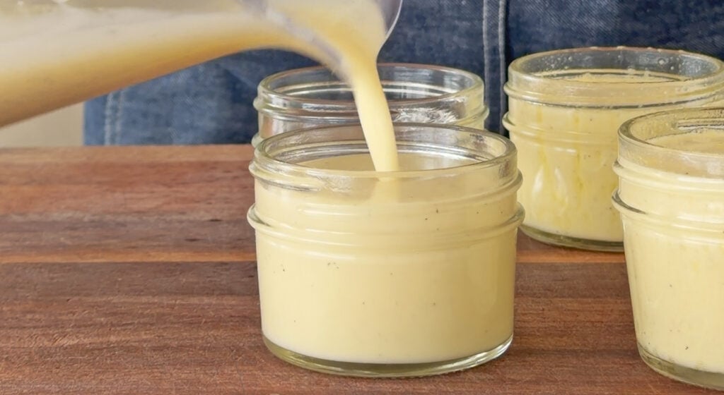 portioning the mixture between the ramekins