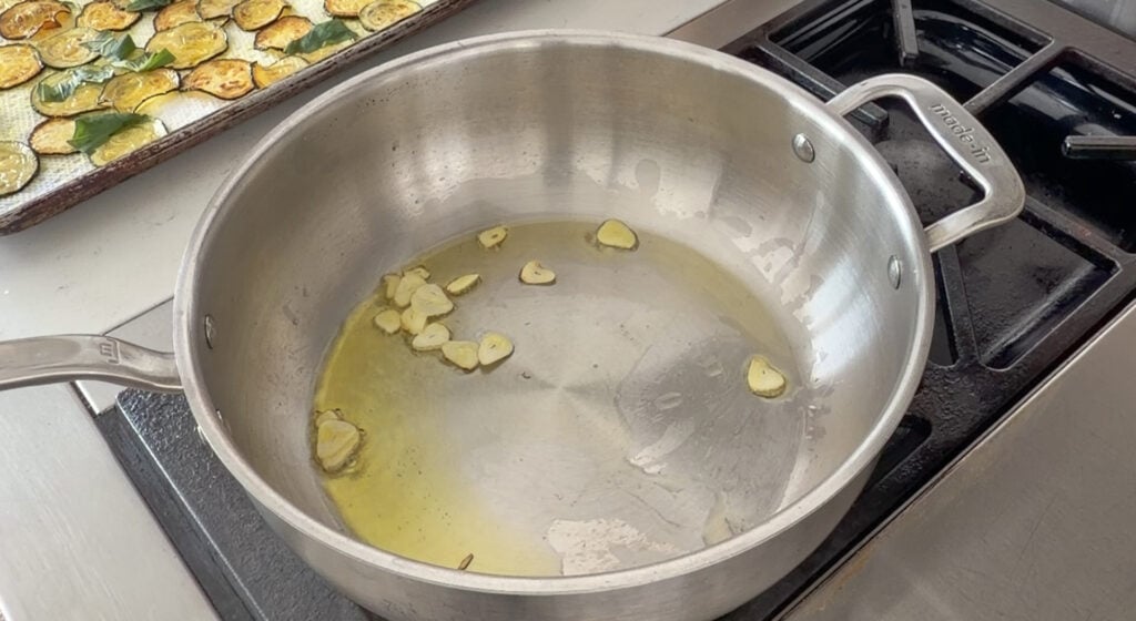 cooking the garlic in a pan