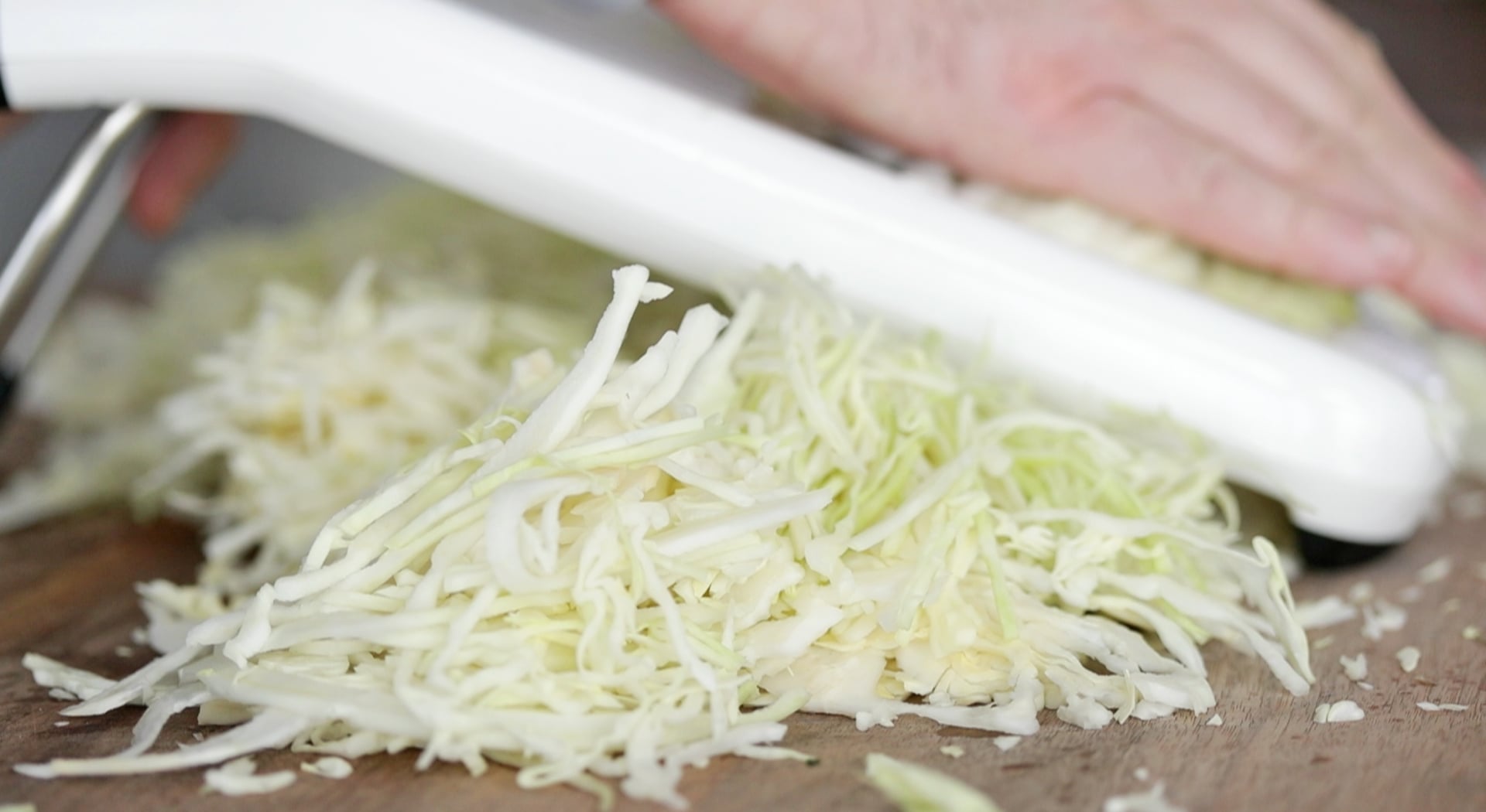 thinly slicing cabbage