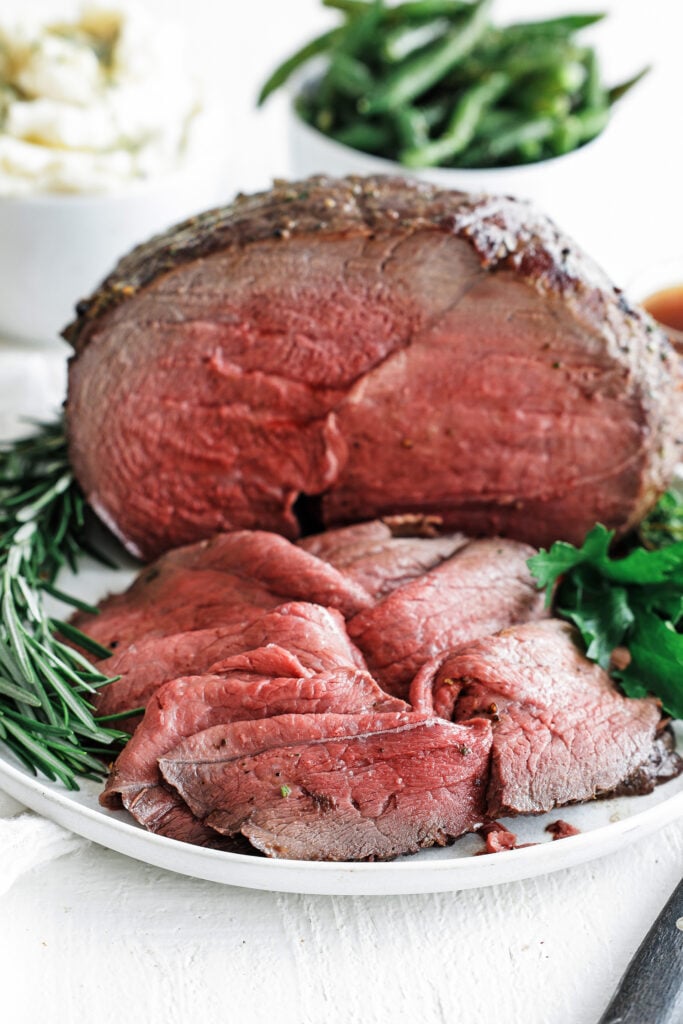 Sirloin Tip Roast served on a plate with herbs