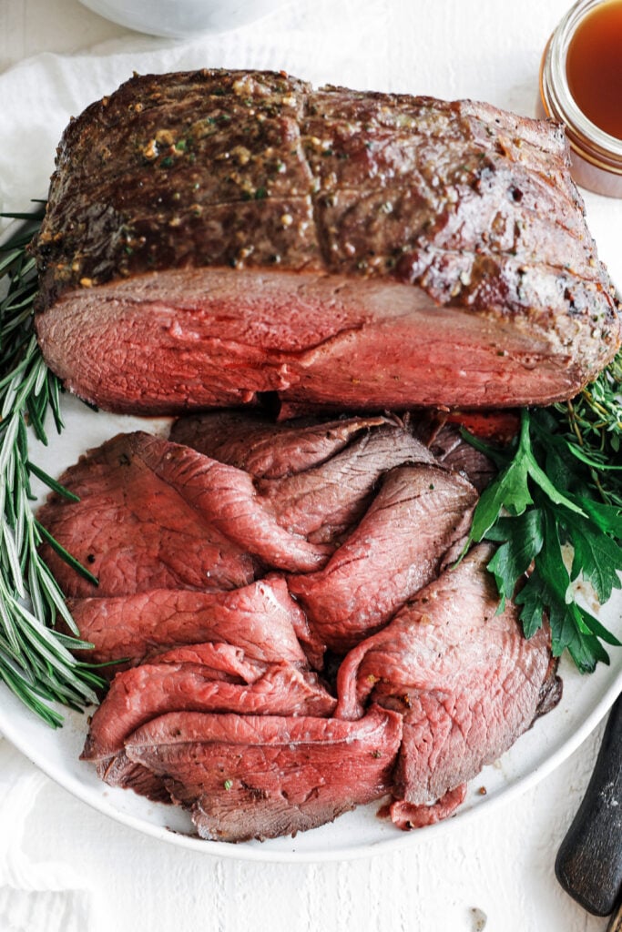 Sirloin Tip Roast served on a plate with herbs