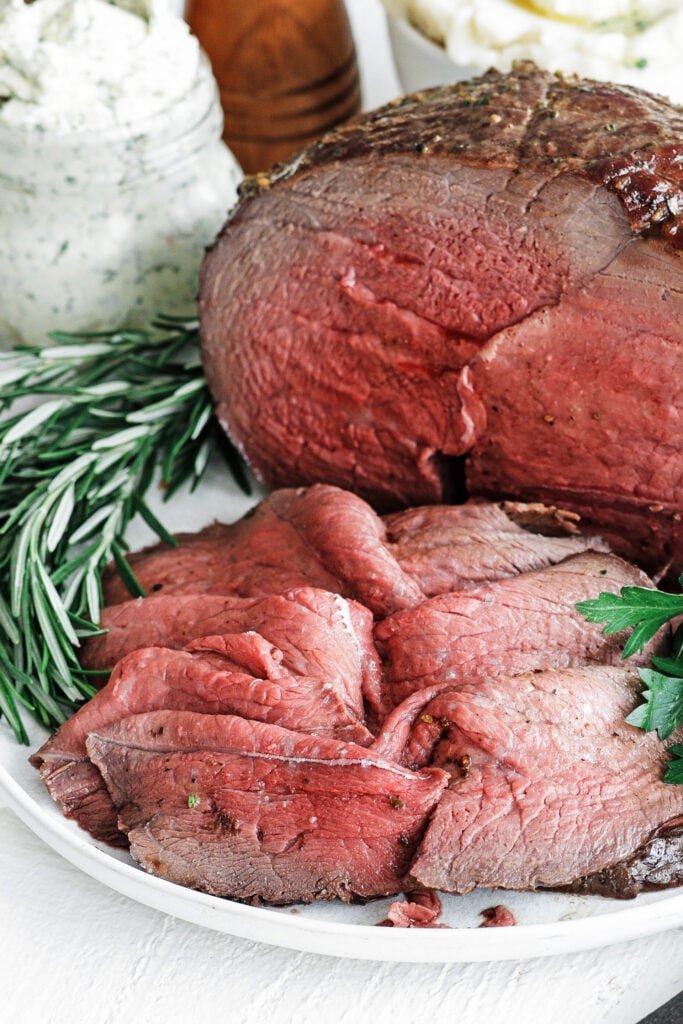 Sirloin Tip Roast served on a plate with herbs