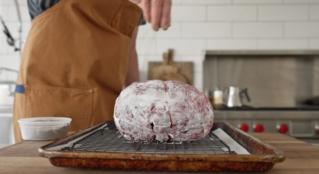 seasoning and brushing the roast with tallow