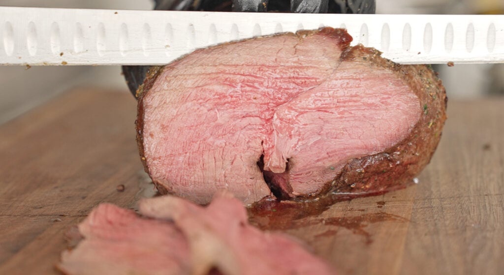 slicing the sirloin tip roast
