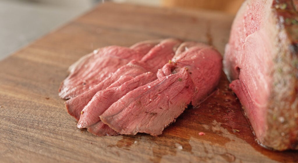 Sirloin Tip Roast sliced on cutting board