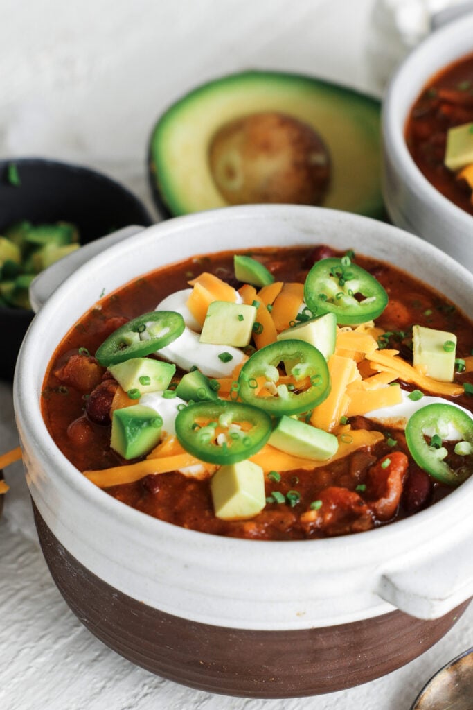 steak chili with cheese and jalapeno toppings
