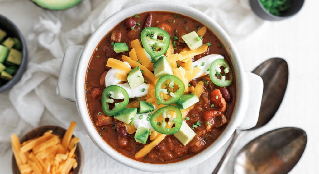 steak chili served on a bowl with toppings