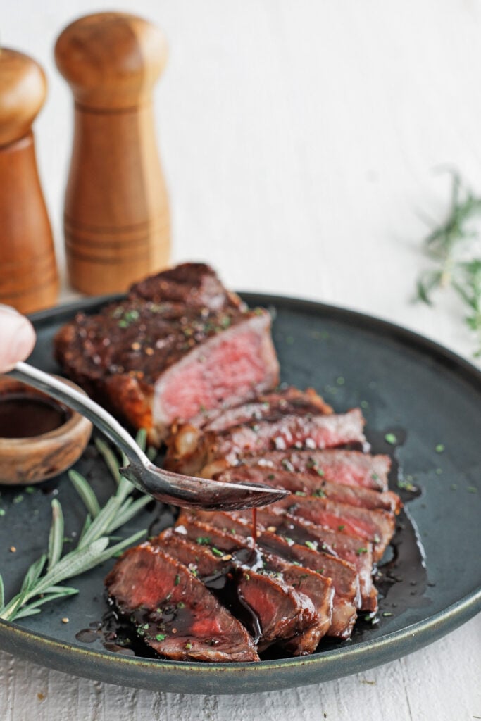 Steak with a spoonful of Red Wine Sauce