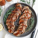 Sliced balsamic glazed pork tenderloin drizzled with sweet balsamic glaze