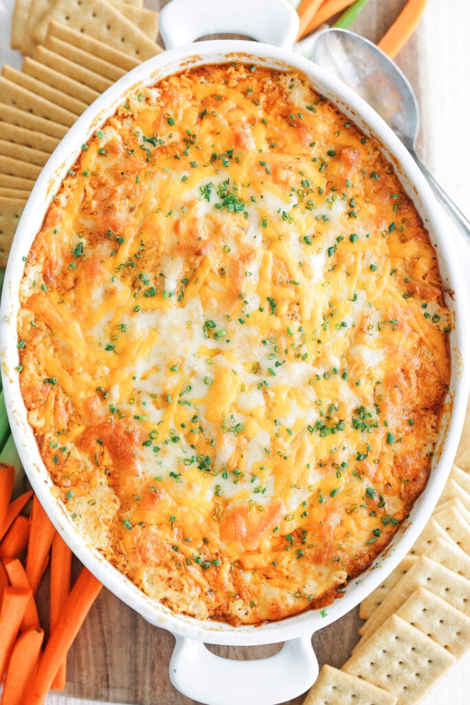 Baked buffalo chicken dip in a white baking dish