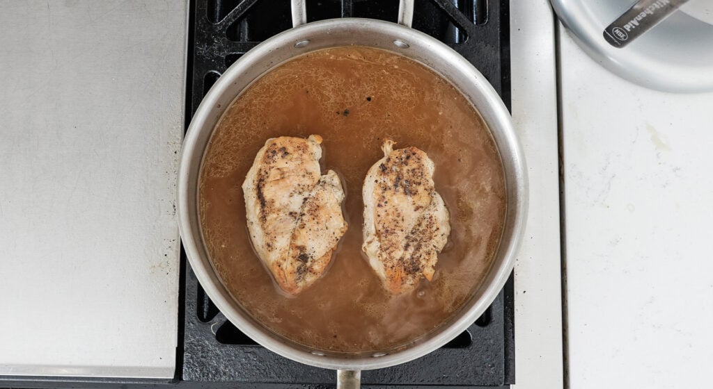 braising in chicken stock for buffalo chicken dip
