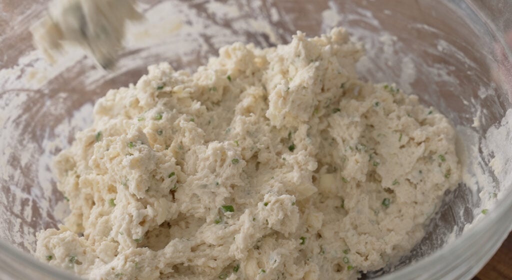 mixing in butter and herbs