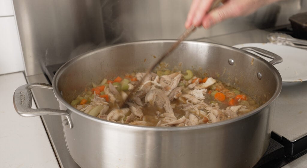 Shredded chicken, cream, and lemon stirred into the finished stew