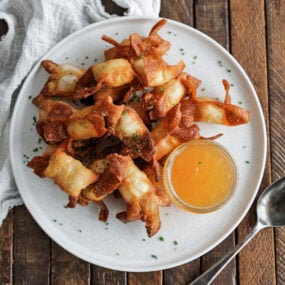 crab ragoon serve on a plate with sauce