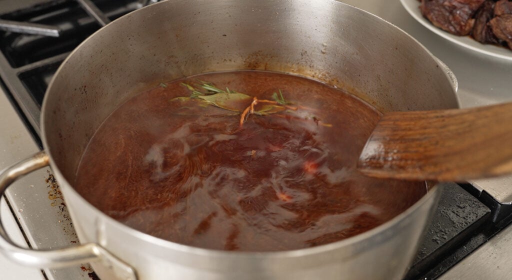 chianti, beef stock, sage, rosemary, and bay leaves 

