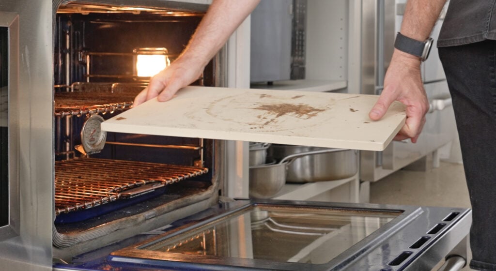 placing the pizza stone in the oven