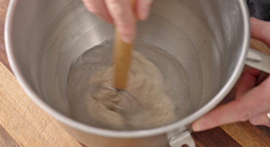 An active sourdough starter at its peak