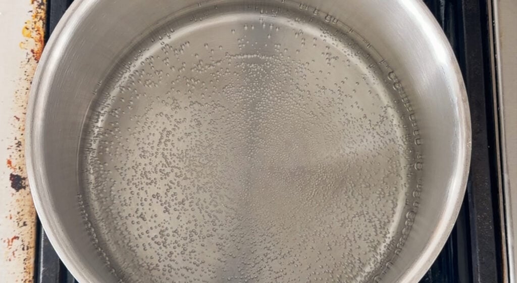 saucepot of water at a low simmer, set up as a water bath
